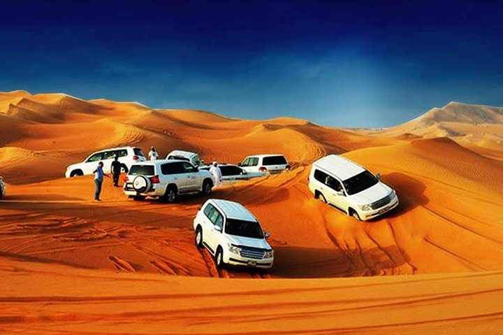 Experience the beauty of Dubai's desert with exhilarating dune bashing in 4X4 Land Cruisers stunning scenery and exciting activities like camel rides and traditional performances.